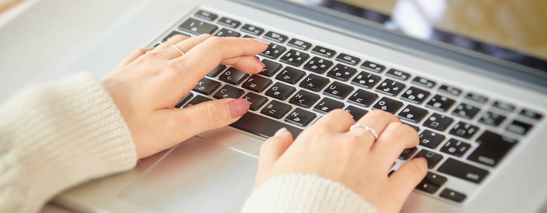 Woman sitting at desk and connecting with her laptop, she is wor